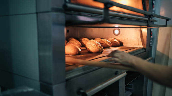 Baker making bread at a bakery  Bakery Concept 