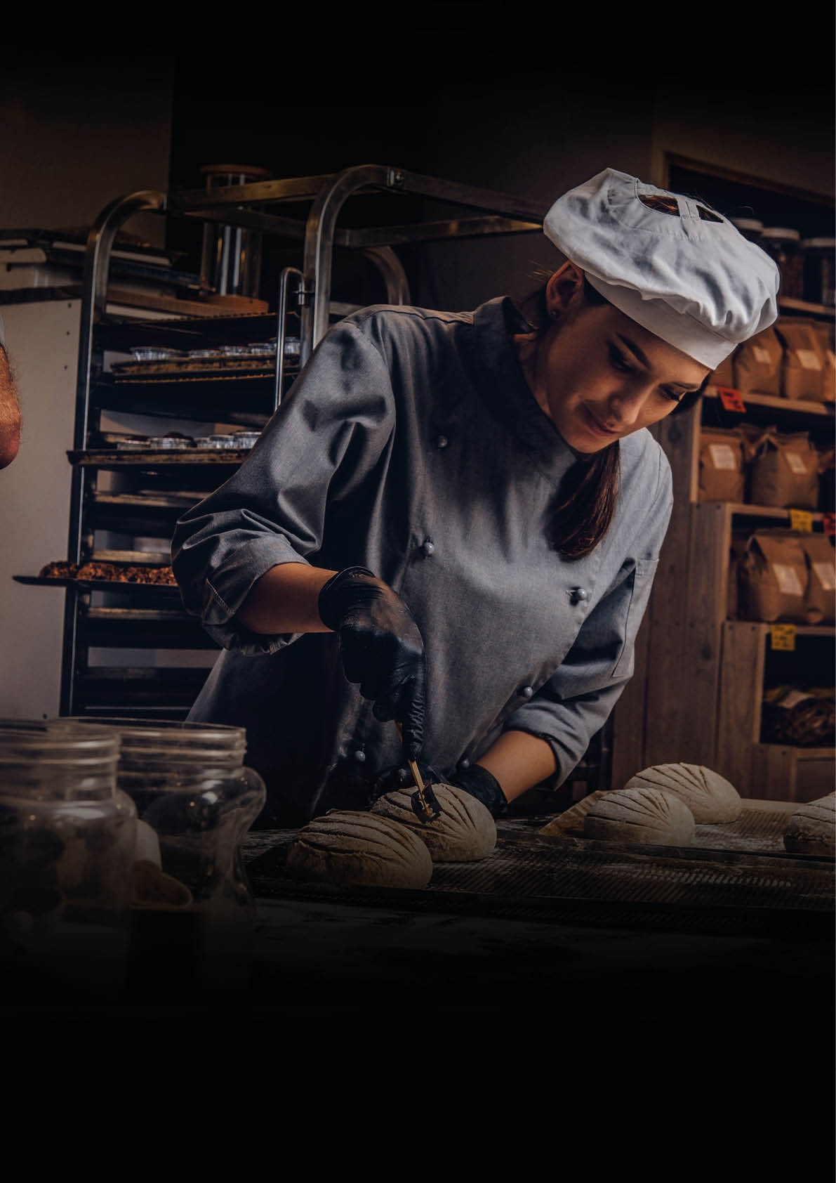 Cooking master class in bakery  Chef with his assistant showing ready samples of baking test in kitchen 