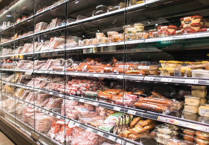 Rotterdan   Netherlands - September 15, 2019 : Rows of fresh chilled food in a chiller cabinate in a food shop 