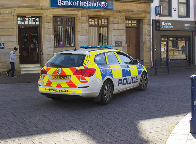 14 September 2017 A PSNI police patrol car cruising the pedestrian zone outside the Bank of Ireland in the Diamond in Coleraine, Northern Ireland