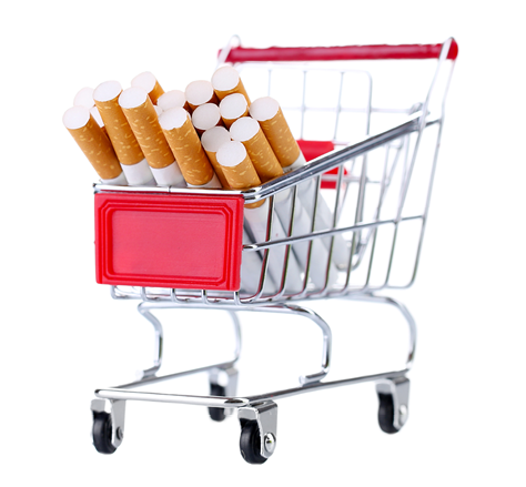 Cigarettes in shopping cart isolated on white