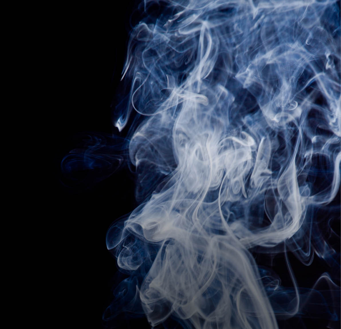 Tobacco smoke. On black background.