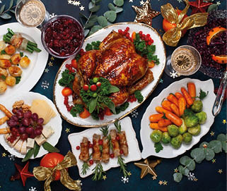 Concept of Christmas or New Year dinner with roasted chicken and various vegetables dishes. Top view.