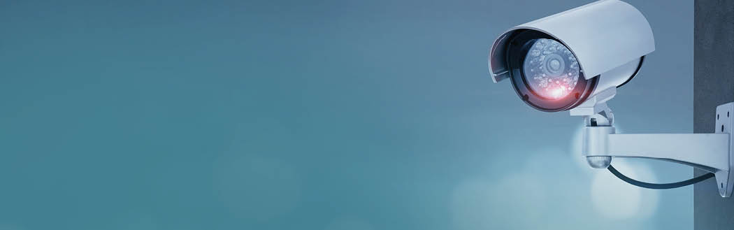 Close up of CCTV camera over defocused background with copy space