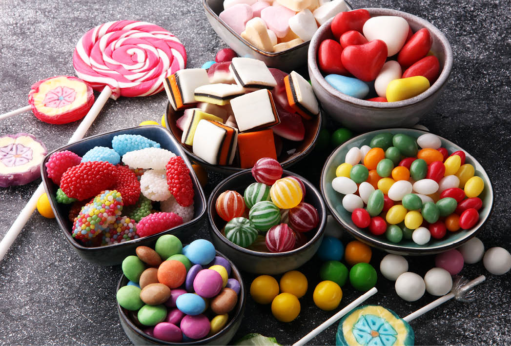 candies with jelly and sugar. colorful array of different childs sweets and treats