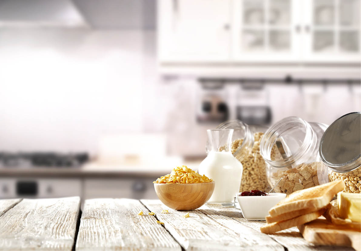 Spring breakfast with cornflakes in the sunny kitchen