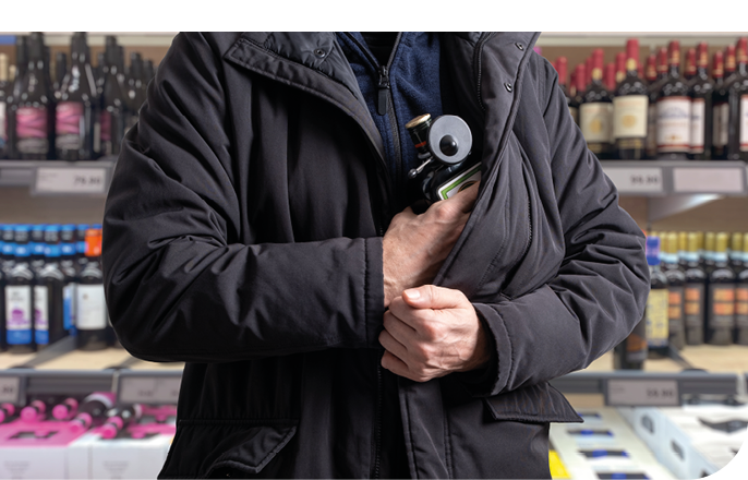 theft incident as a shoplifter attempts to steal a bottle of alcohol equipped with a Magnetic RF Bottle Tag security device, shoplifting anti-theft protection in-store operations.