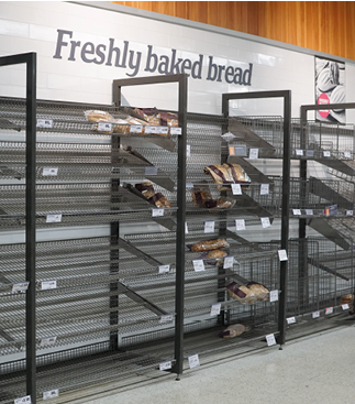 London, England - March 30 2020 - Empty bakery shelves in a supermarket in Balham during the Coronavirus crisis of 2020, which led to customers stockpiling food and goods.