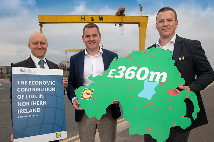 Pictured as a new report marking its 25th anniversary reveals that Lidl Northern Ireland pumped a record £360 million into the local economy in 2023, doubling its annual economic contribution over the past five years, are from left, the report’s author Neil McCullough, Associate Director, Oxford Economics, J.P. Scally, Chief Executive Officer Lidl Ireland and Northern Ireland, and Ivan Ryan, Regional Managing Director, Lidl Northern Ireland.
