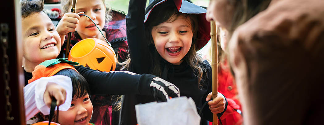 Little children trick or treating on Halloween