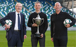Sterling Insurance, one of the UK’s leading insurance brokers, has announced a three-year partnership with the SuperCupNI - one of the world's most renowned international youth football tournaments. The UK-based insurance broker will kick-off a multi-year tournament partnership with the SuperCupNI this summer with high-profile clubs like Manchester United, West Ham United, Celtic and Rangers set to visit Northern Ireland for the week-long event taking place from Sunday 21st to Friday 26th July 2024. Pictured launching the partnership is Northern Ireland football legend Aaron Hughes alongside Victor Leonard, Chairperson of the SuperCupNI and Andy Morton, General Manager at Sterling Insurance.  
