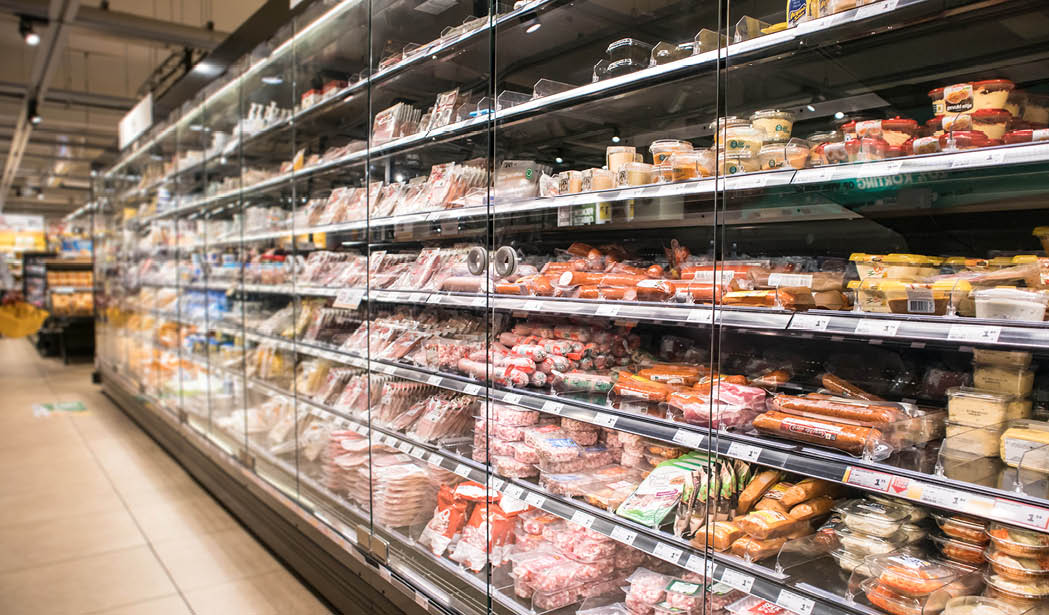 Rotterdan / Netherlands - September 15, 2019 : Rows of fresh chilled food in a chiller cabinate in a food shop.