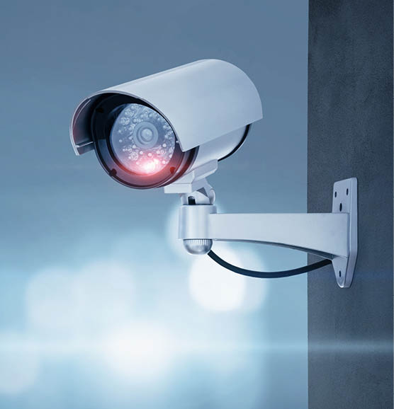 Close up of CCTV camera over defocused background with copy space