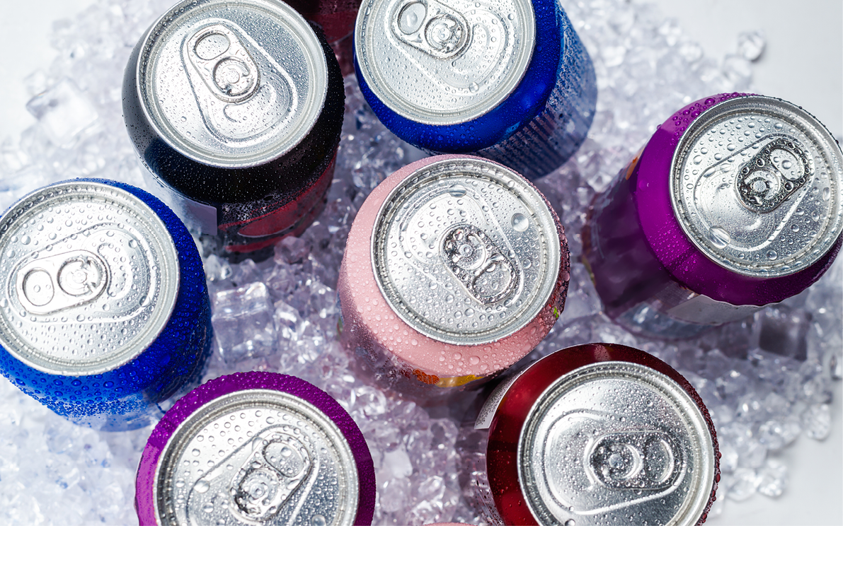 Group of aluminium cans in ice, cold drink. Top view.