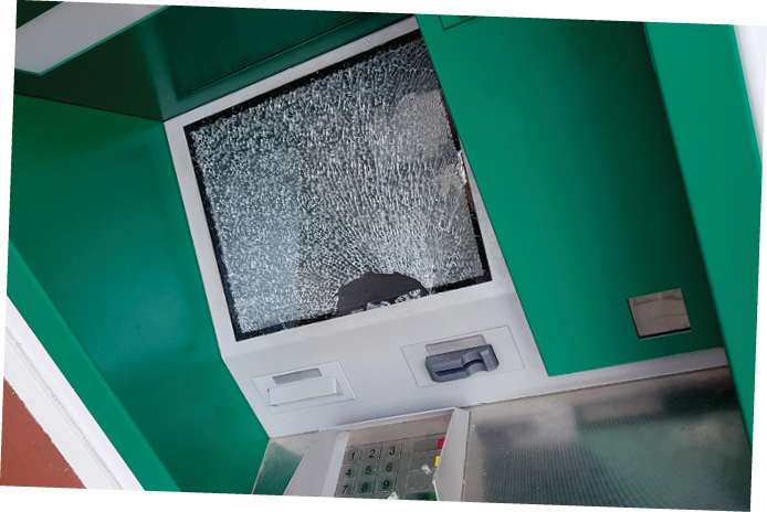 The attacker committed a robbery of an ATM smashing glass and showered fragments