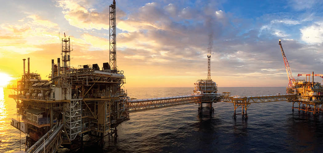 Panorama view of offshore oil and Gas processing platform in sunset time, Concept of exploration and petroleum production industry in the sea.