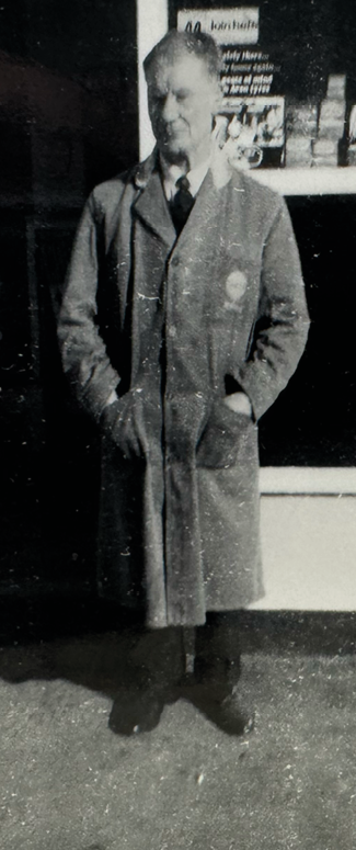 A man in a suit stands outside a store. AI generated content