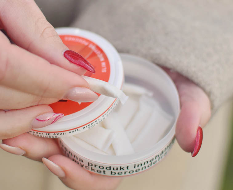 A person is holding a jar of lotion in their hand. AI generated content