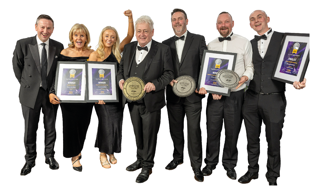 A group of people holding trophies. Description generated by AI