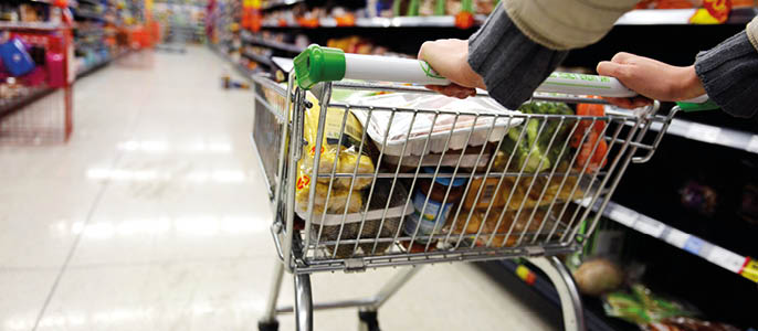A shopping cart filled with food. Description generated by AI