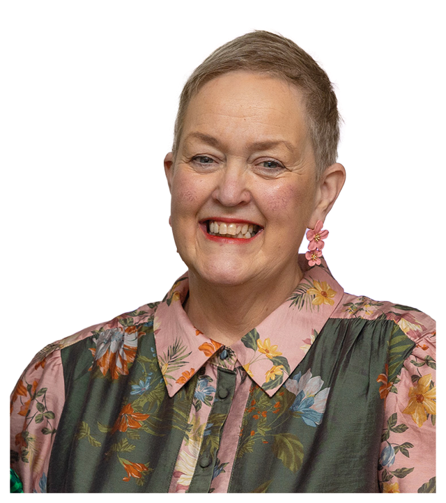 A woman with a pink shirt and earrings. Description generated by AI