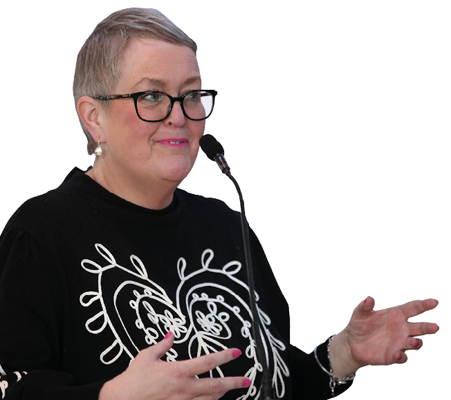 A woman wearing a black shirt with a heart design on it. Description generated by AI