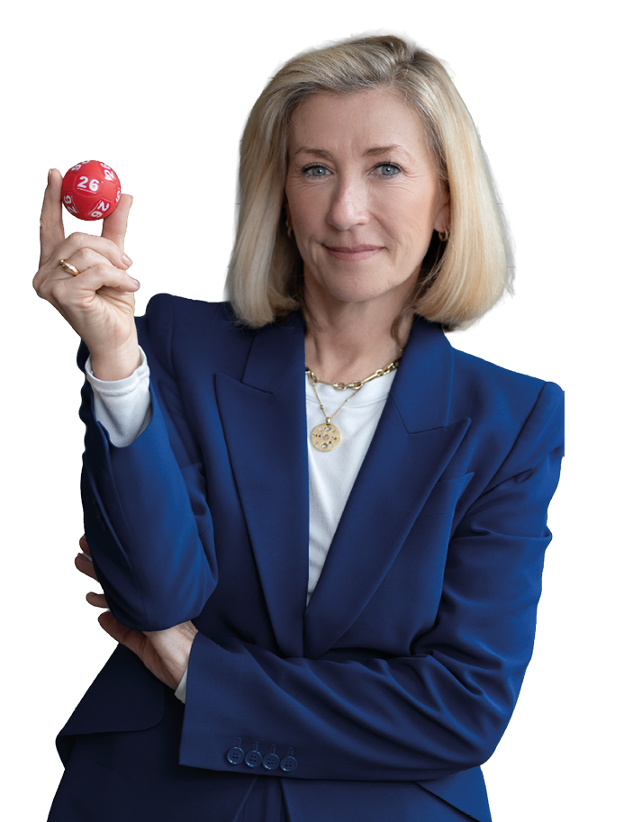 A woman is holding a red ball. Description generated by AI