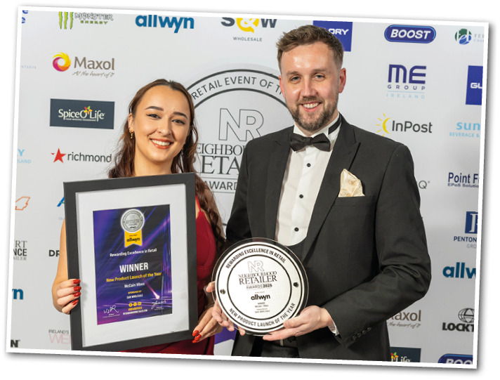 A man and woman holding a trophy. Description generated by AI