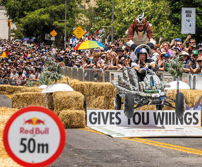 A red bull sign is on the road. Description generated by AI
