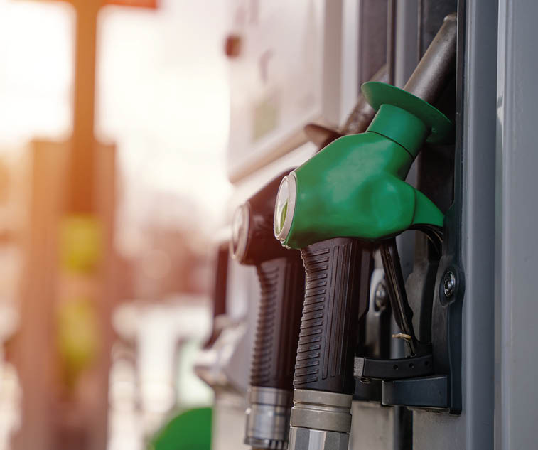 Gas pump with green and white colors. Description generated by AI