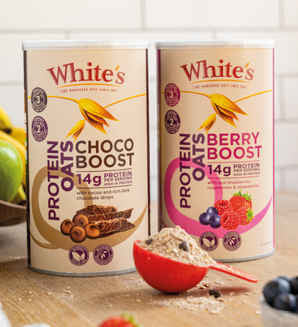 Two cans of White's chocolate and berry protein boost. Description generated by AI