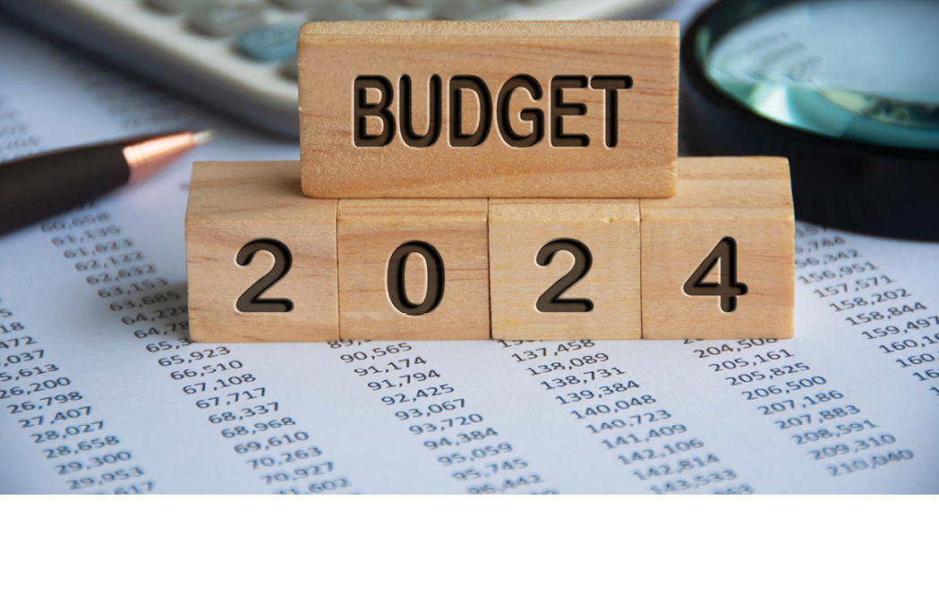 Budget 2024 text on wooden blocks with data analysis and office concept background. Budgeting concept.