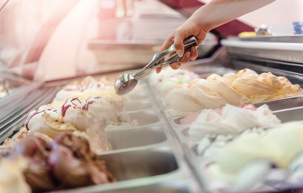 Woman serving ice cream in Confectionery shop