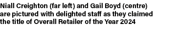 Niall Creighton (far left) and Gail Boyd (centre) are pictured with delighted staff as they claimed the title of Over...
