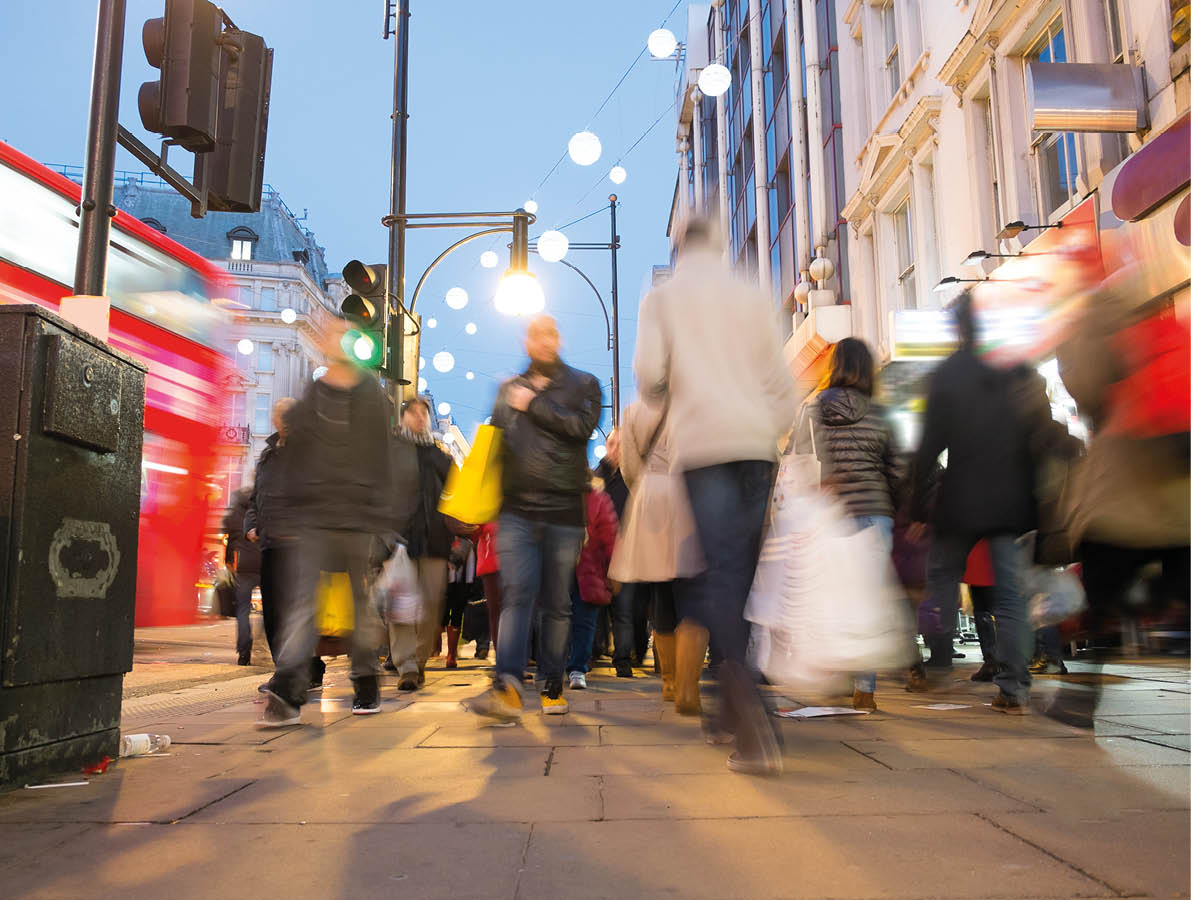 Blur movement of city people worker, shopping on Oxford Street, London, England, UK 