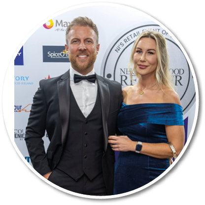A man and woman standing together. Description generated by AI