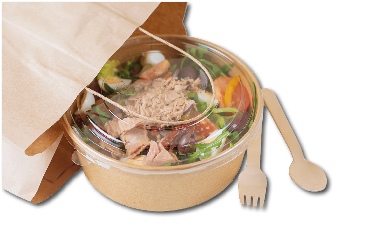 A takeout paper bag partially open with a clear-lidded container of salad and wooden fork and spoon beside it. Description generated by AI