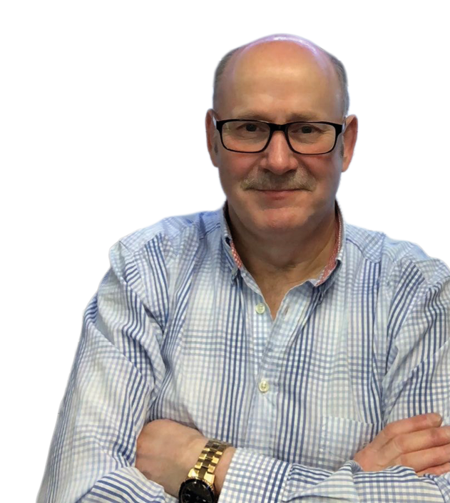 A senior person wearing glasses and a checkered shirt is sitting with arms crossed and smiling slightly against a white background. Description generated by AI