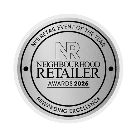 A silver award for the best neighborhood retailer of the year. Description generated by AI