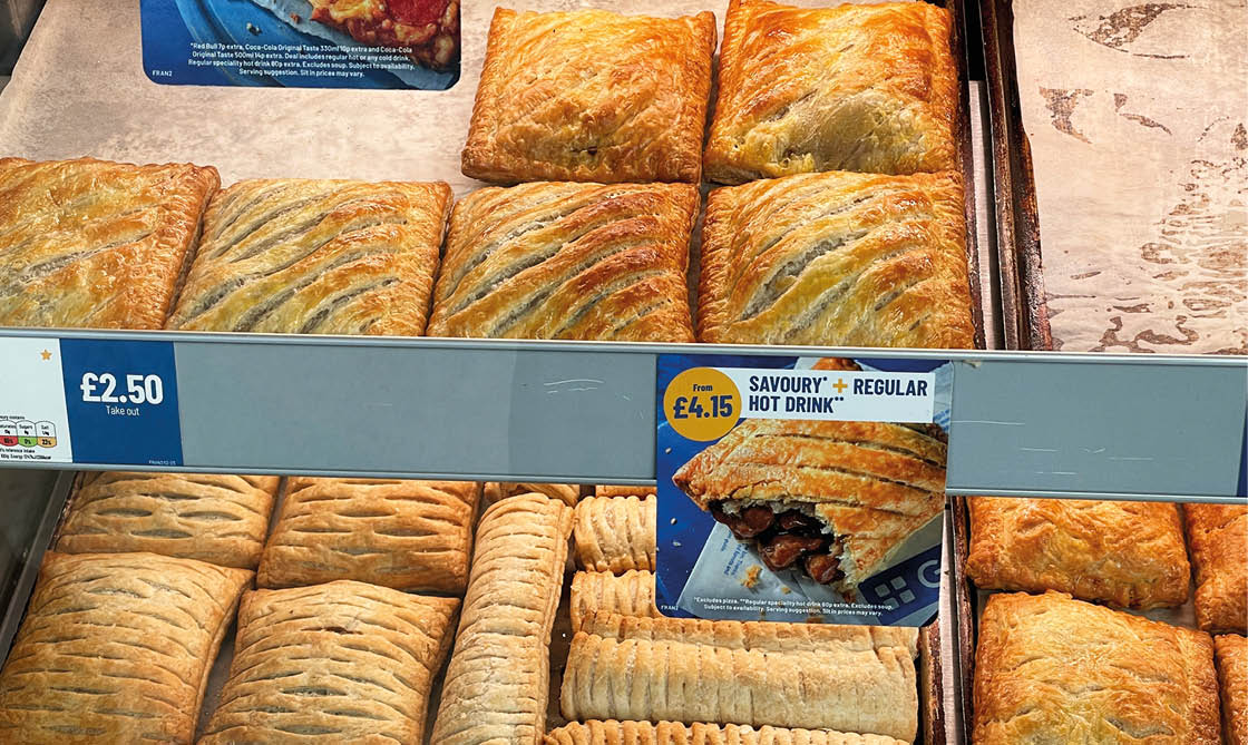 Oxford UK –January 2024. Greggs baked chicken and mushroom slice , sausage rolls for sale