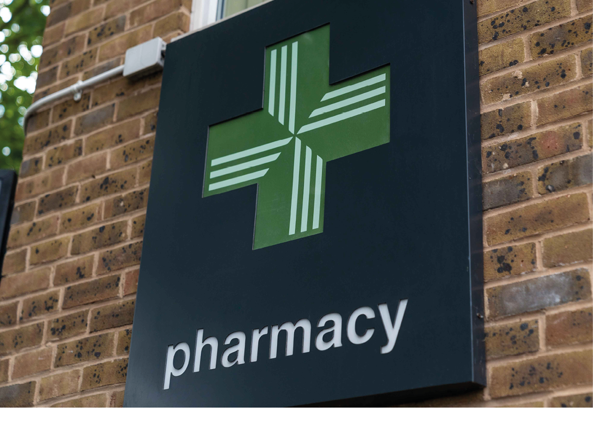 UK, London, 1/7/2020 - A close up shot of a a green cross Pharmacy logo sign