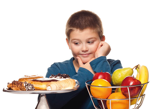 a boy's choice of a healthy or unhealthy snack