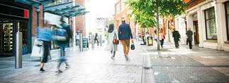 Anonymous shoppers walking on a shopping high street