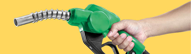 Hands holding Fuel nozzle on yellow background