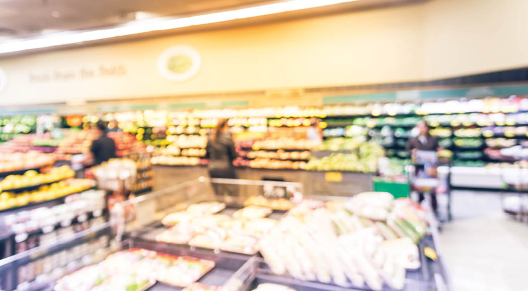 Vintage tone blurred background image customer shopping at local grocery store in San Francisco. Fresh fruits and vegetables on display. Organic, locally grown produces, healthy food in supermarket