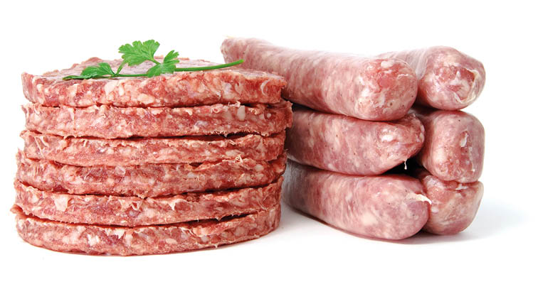 a pile of burgers and sausages isolated on a white background