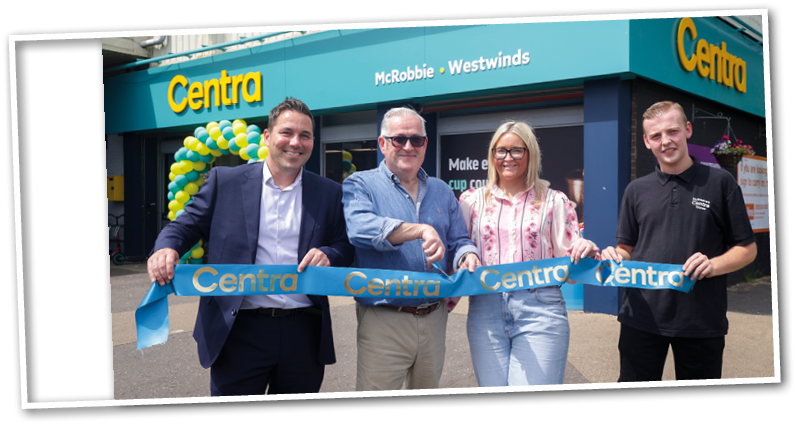 Four adults stand outside a store named Centra holding a blue ribbon with the store's name, appearing to celebrate a grand opening. Description generated by AI