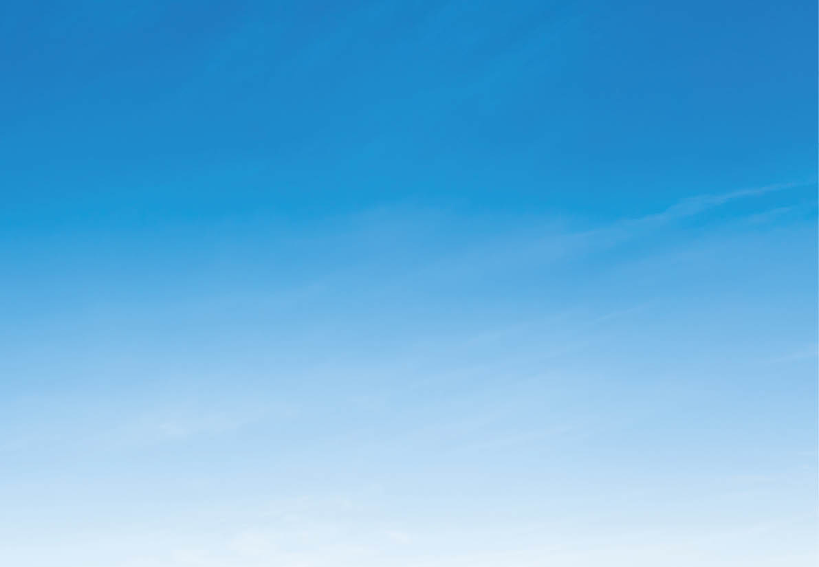 A clear blue sky with a subtle gradient from deeper blue at the top to lighter blue near the horizon. Description generated by AI