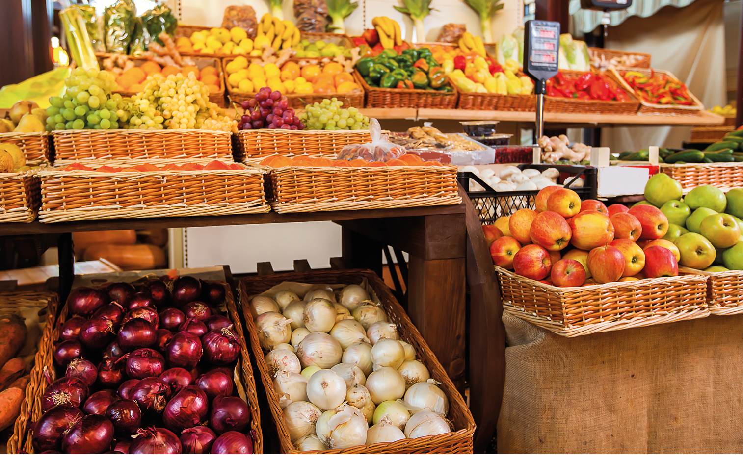 Counters with fresh fruits and vegetables.