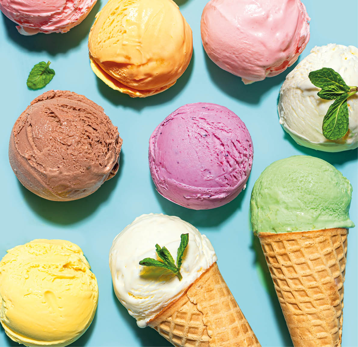 A collection of ice cream cones and scoops in various flavors and colors. AI generated content